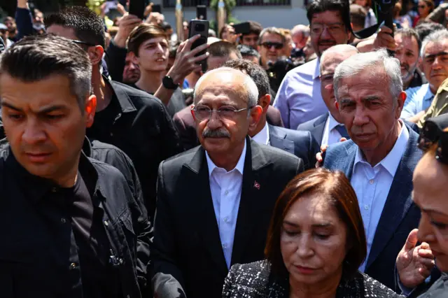 Kemal Kilicdaroglu and his wife Selvi leave a polling station in Ankara