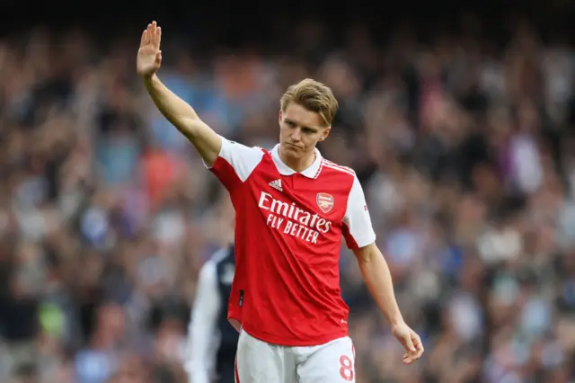 Martin Odegaard waves to Arsenal fans after the team's defeat by Brighton