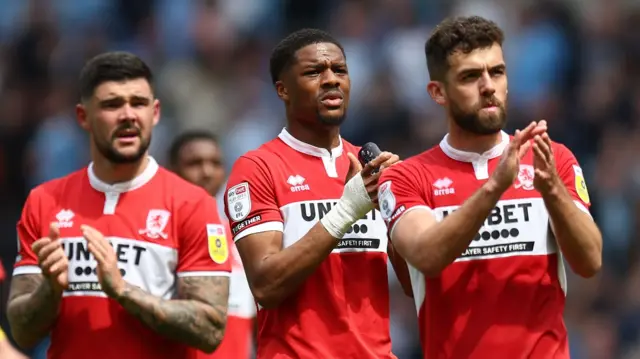 Boro players applaud