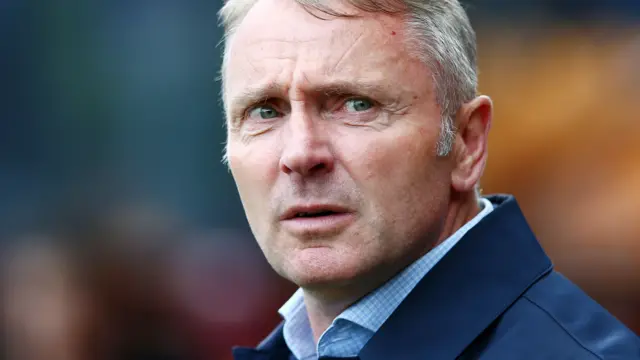 Carlisle manager Paul Simpson watches on the touchline