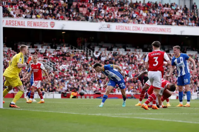 Brighton's Julio Enciso scores against Arsenal