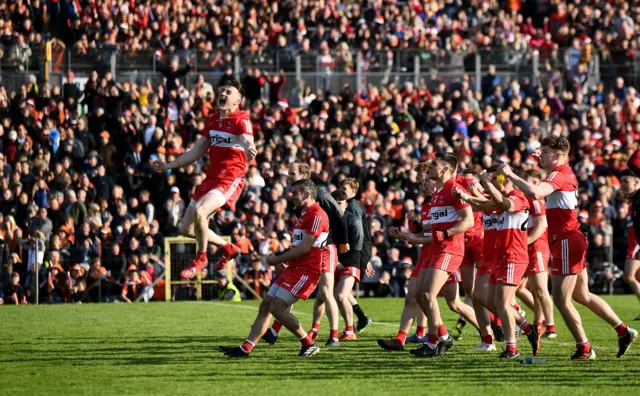 Derry players celebrate their success