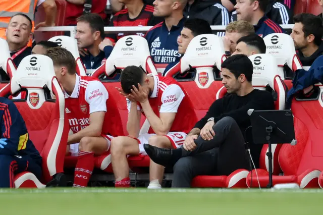 Manager Mikel Arteta and midfielder Jorginho looking disappointed on the Arsenal bench during the team's defeat by Brighton