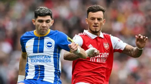 Brighton's Julio Enciso fights for the ball with Arsenal's Ben White