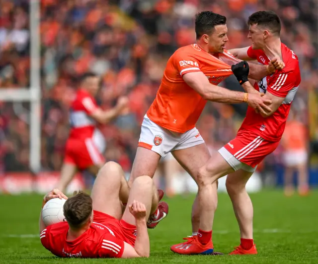 Armagh's Aidan Forker and Gareth McKinless get to grips with each other