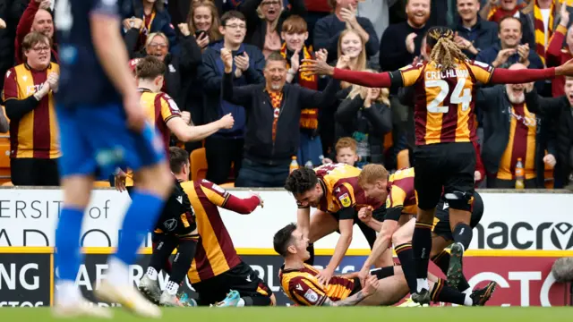 Bradford celebrate scoring against Carlisle