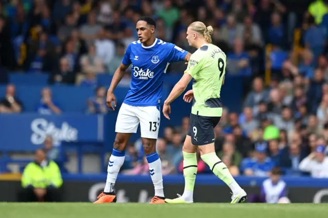 Everton's Yerry Mina pushes Manchester City's Erling Haaland