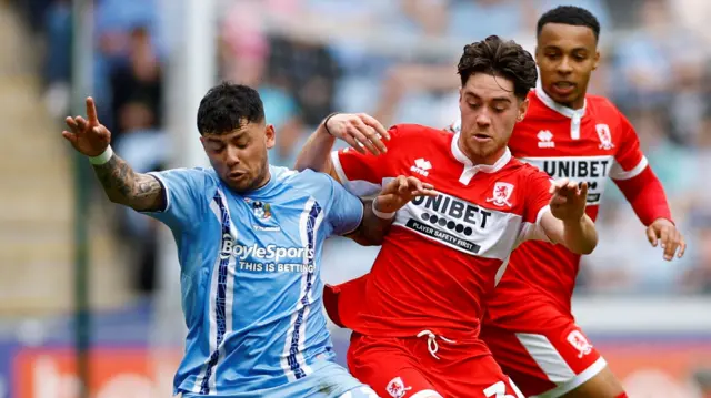 Coventry and Middlesbrough players challenge for the ball