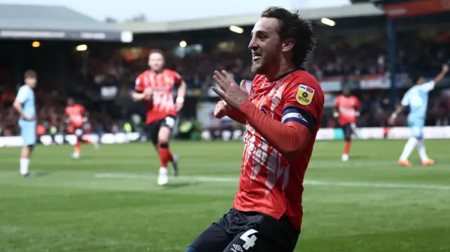 Tom Lockyer celebrates his goal for Luton