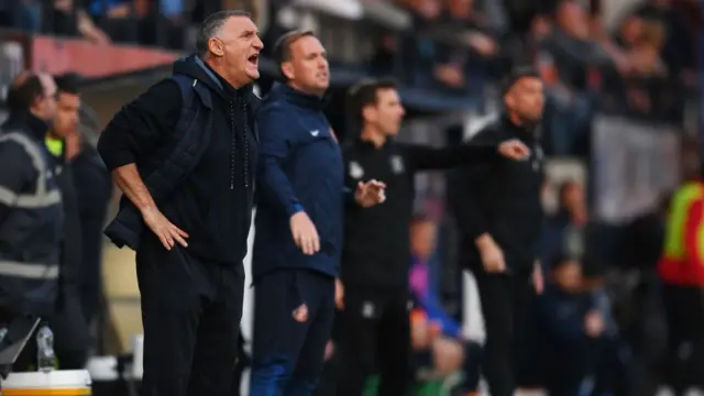 Tony Mowbray stands on the touchline