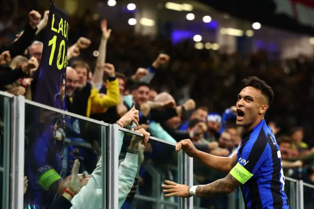 Lautaro Martinez celebrates the winner with Inter fans.