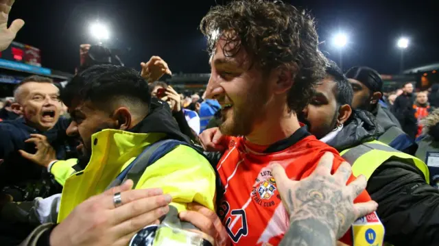 Tom Lockyer celebrates Luton's victory