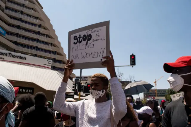 A protester holds a placard during the second day of the #ShutItDown Protests, where hundreds of Namibian youth protested against gender-based violence by shutting down Windhoek's Central Business District, in Windhoek, Namibia, on October 9, 2020.