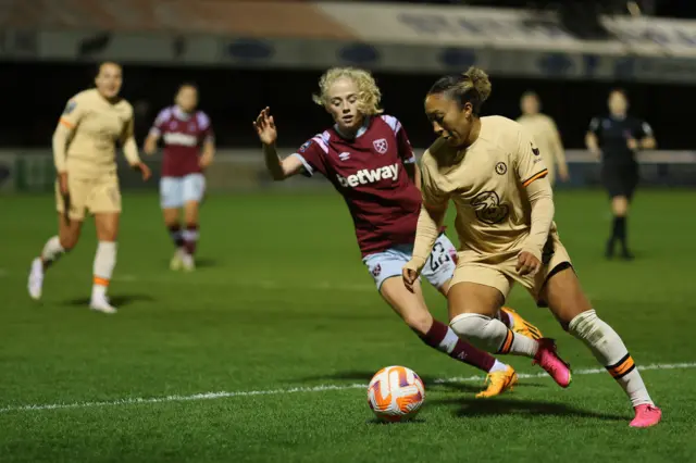 Lauren James of Chelsea is put under pressure by Grace Fisk of West Ham United