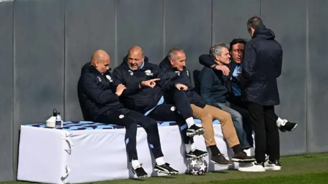 Pep Guardiola (left) and the Man City coaching team