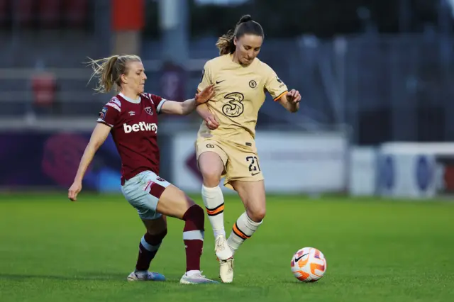 Niamh Charles of Chelsea is put under pressure by Kate Longhurst of West Ham United