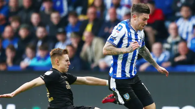 Josh Windass carries the ball for Sheffield Wednesday