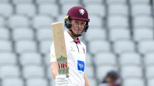 James Rew celebrates scoring a century