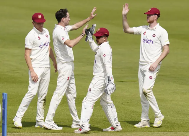 Jordan Buckingham takes a wicket for Northants