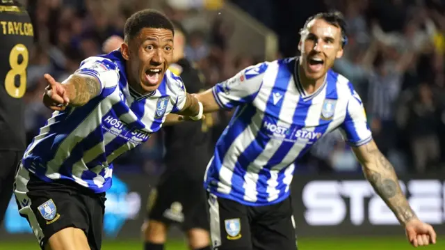 Liam Palmer celebrates his goal