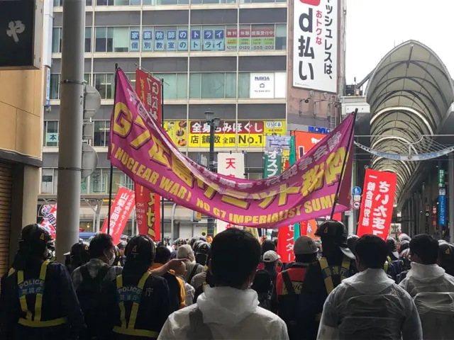 Anti-war protesters and police in Hiroshima, Japan during 2023 G7 Summit