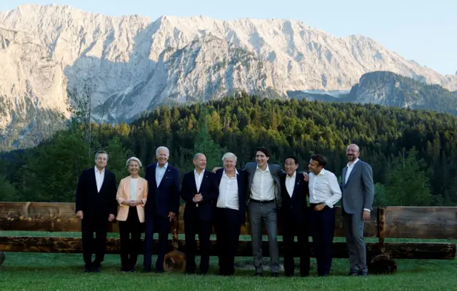 The leaders of G7 countries and two senior EU officials standing for a photo in front of a Bavarian mountain in Germany at the 2022 summit