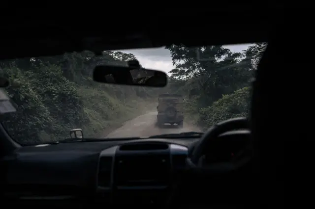 Virunga National Park rangers drive along the road leading from Goma to Rutshuru territory in eastern Democratic Republic of Congo