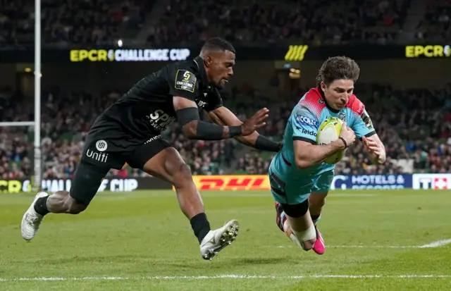 Glasgow Warriors' Sebastian Cancelliere goes over to score their side's first try, despite pressure from Toulon's Jiuta Wainiqolo during the ECPR Challenge Cup final at the Aviva Stadium