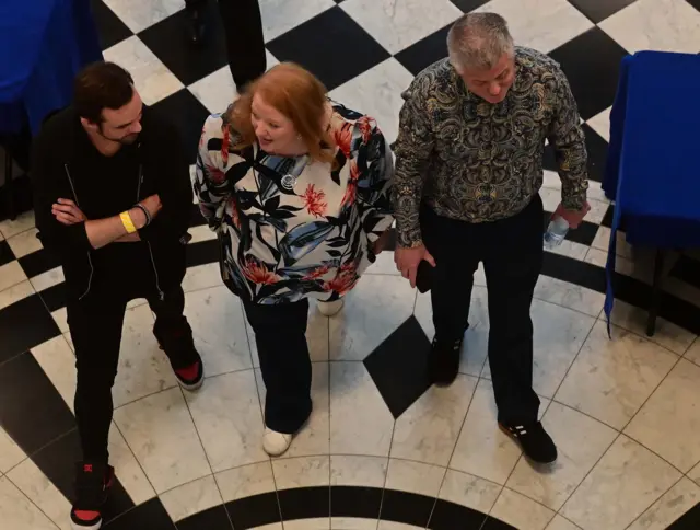 Seen from above Alliance Party leader Naomi Long and her husband Michael Long who is an Alliance Party candidate.