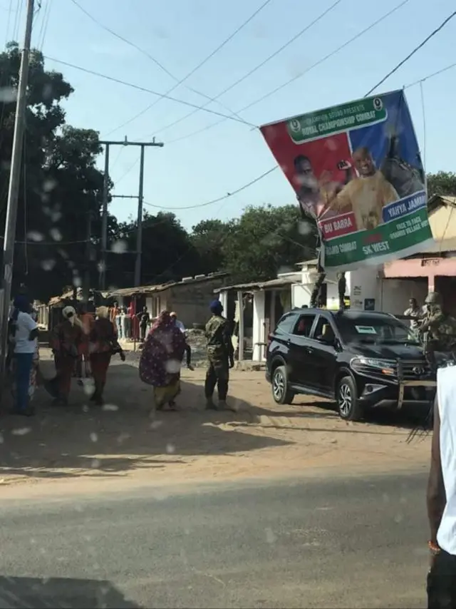 Images of soldiers pulling down opposition banner in the Greater Banjul Area