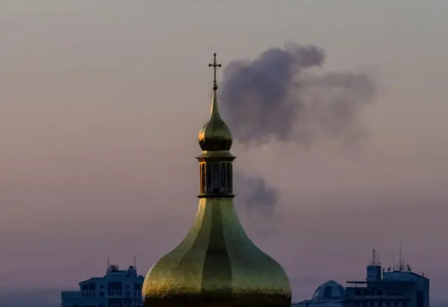 Smoke rises after a Russian attack appears to have been shot down over Kyiv earlier