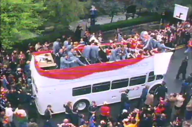 The open top bus makes it's way through the streets of Wrexham town centre in 1978.