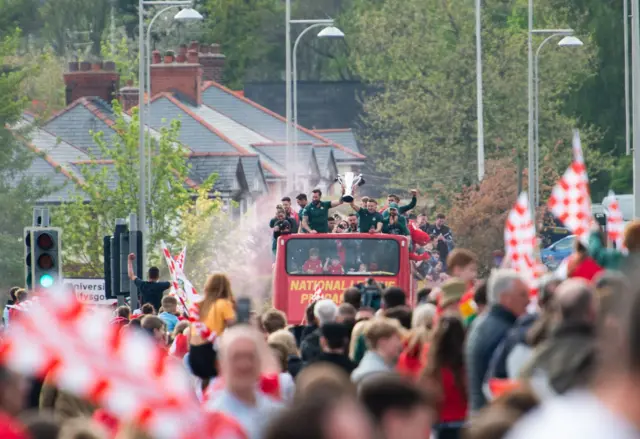 Fans looking at the bus