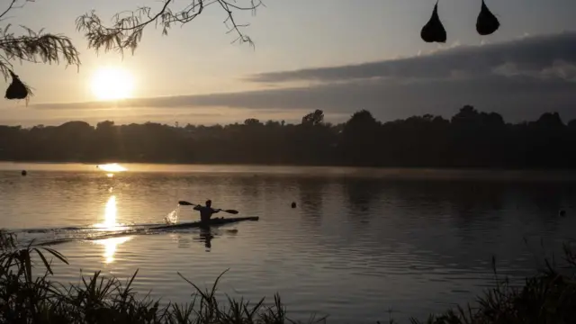 A canoeist in the early morning at the Emmarentia Dam in central Johannesburg, South Africa - 2 May 2023