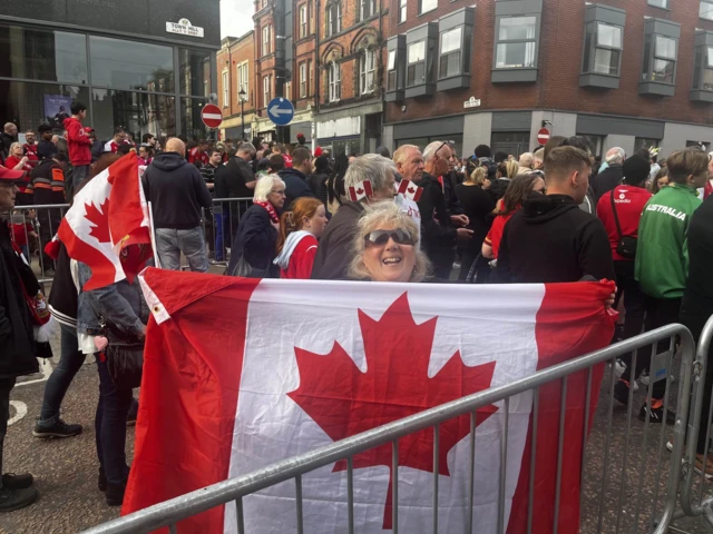 woman holding Canada flag