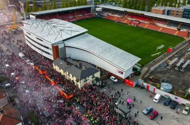 crowds outside Racecourse Ground