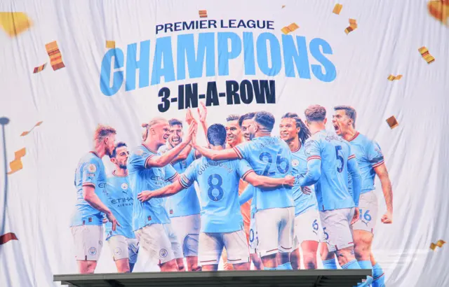 Banner showing Manchester City as three-times Premier League champions