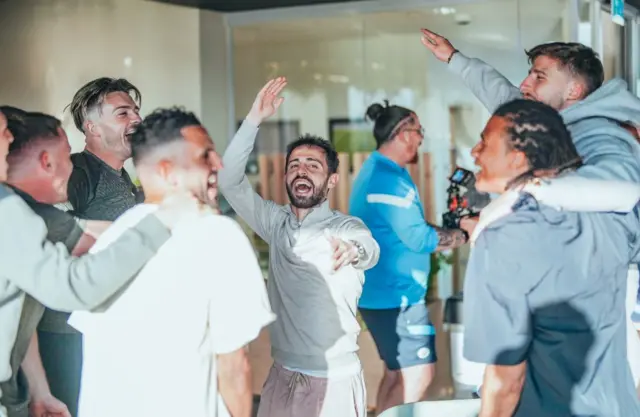 Manchester City players celebrate the title win