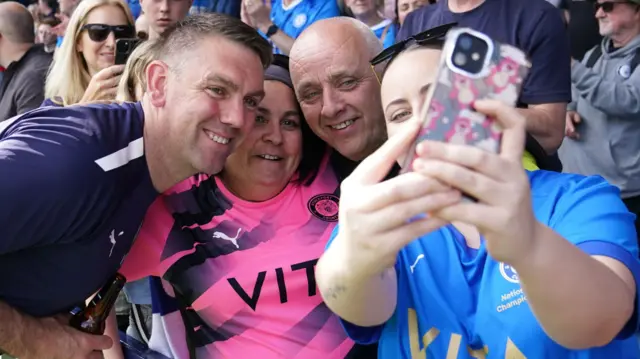 Dave Challinor poses with fans