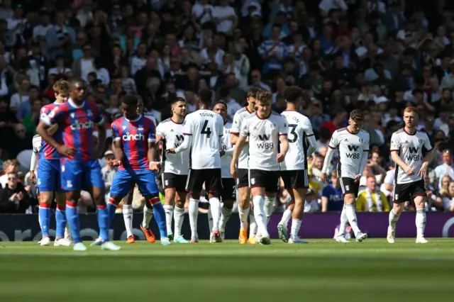 Aleksandar Mitrovic celebrates with teammates