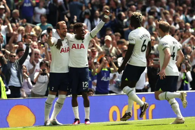 Harry Kane celebrates the opening goal with Emerson Royal