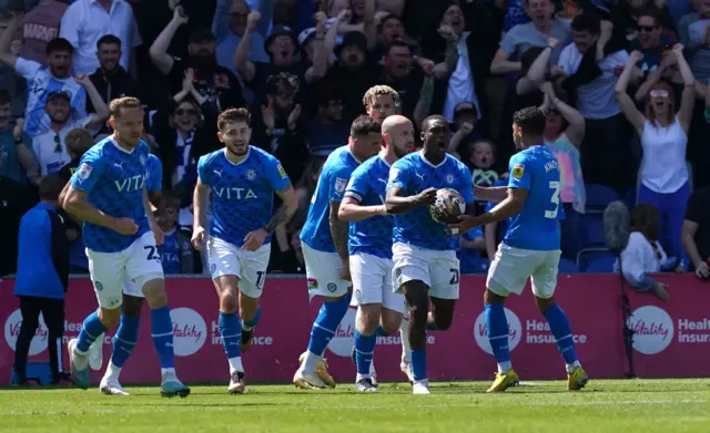 Stockport celebrate their goal to send the game to extra time