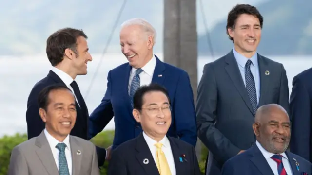 President Biden and President Macron speaking at the G7 summit