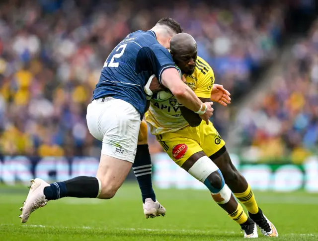 Raymond Rhule of La Rochelle is tackled by Robbie Henshaw of Leinster