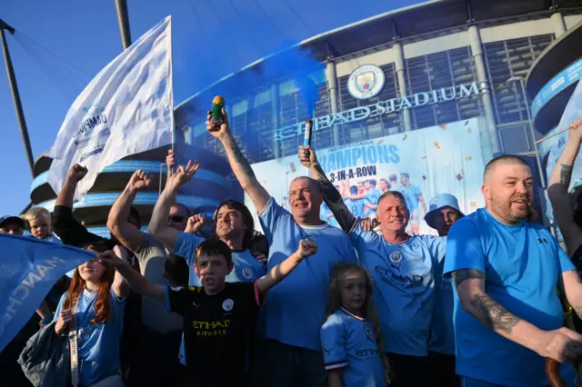 Manchester City fans celebrate their title win