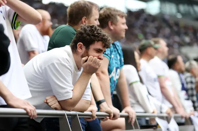 Tottenham fans looking unhappy