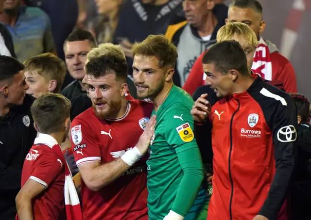 Barnsley's Nicky Cadden and goalkeeper Harvey Isted celebrate