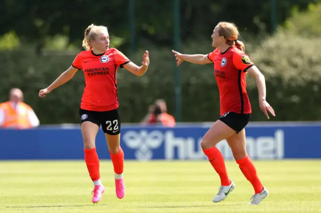 Katie Robinson celebrates with teammate Zoe Morse