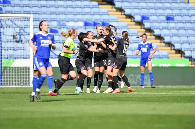 Brynjarsdottir celebrates with teammates after scoring from the penalty spot.