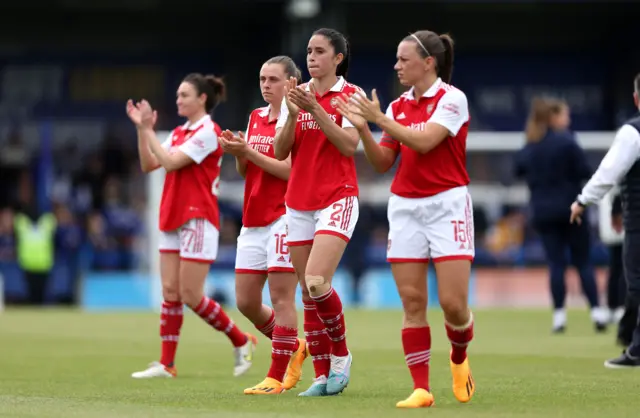 Arsenal players applaud the travelling fans.